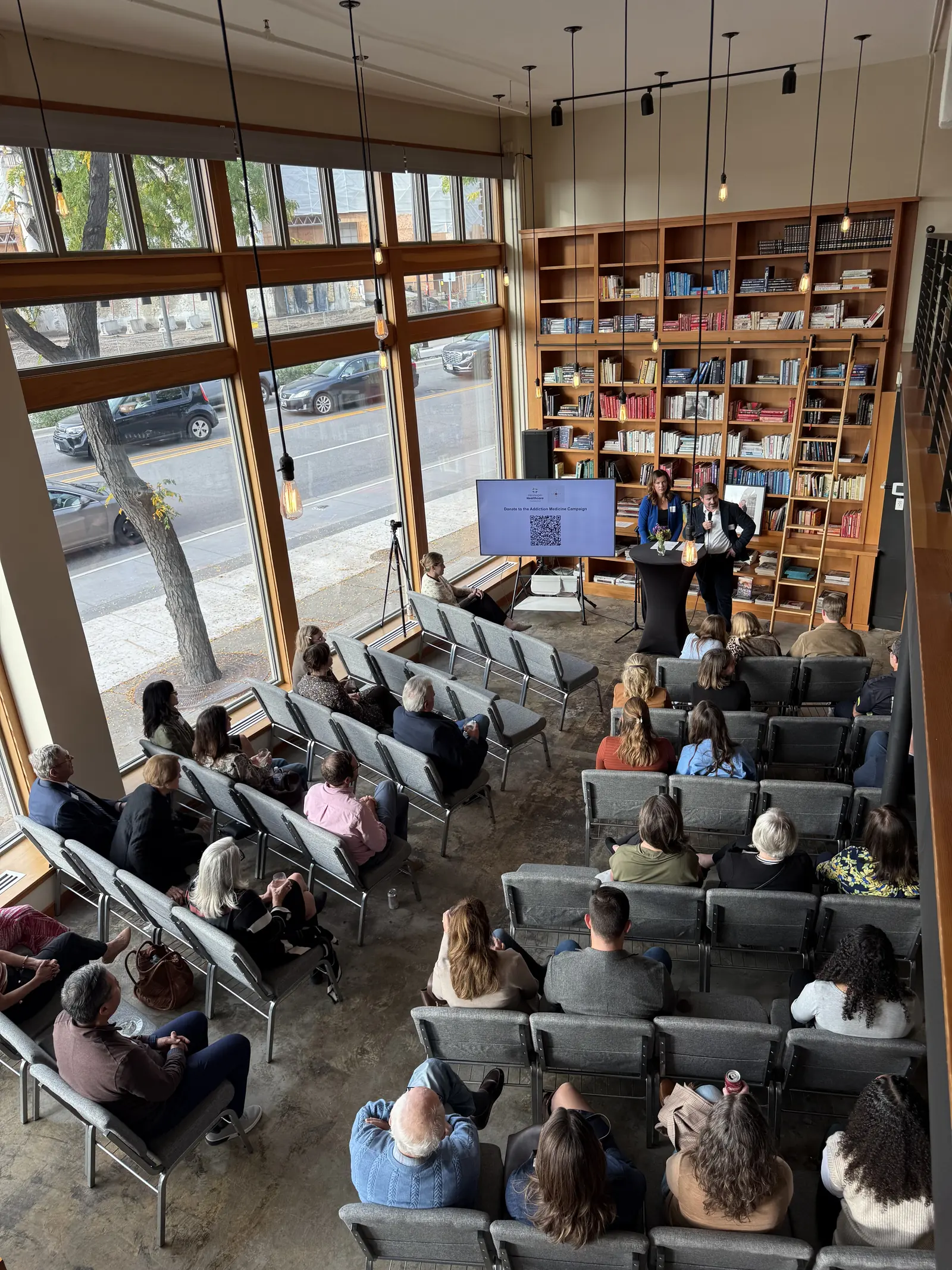 A full lecture-style event seen from the mezzanine