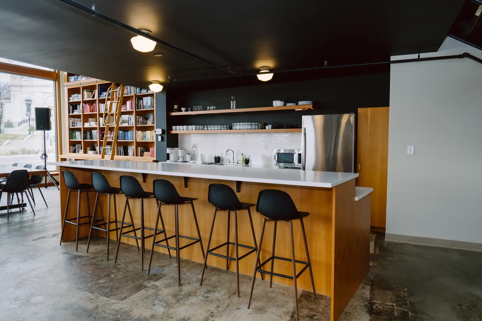 Kitchen bar with seating for six and open shelving